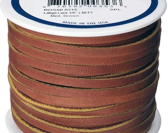 May include: A spool of brown leather cord with a tan edge. The cord is wound tightly around the spool. The label on the spool reads "Real Leather Craft Lace" and "Latigo Lace 1/8" x 60 FT Med. Brown".