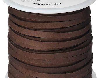 May include: A spool of brown deerskin leather lace, 1/8 inch wide and 50 feet long. The label reads "REALEATHER Craft Lace" and "DOS50 0207". Made in the USA.