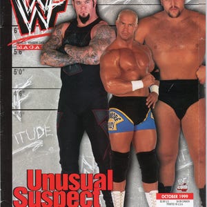 May include: A magazine cover featuring three professional wrestlers. The cover has the WWF logo and the title "Unusual Suspect." The wrestlers are muscular and wearing wrestling attire. The magazine is dated October 1999.