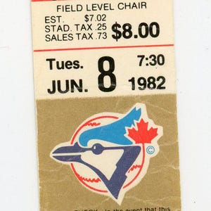 May include: Vintage baseball ticket from June 8, 1982, with section 9, row 13, seat 30. Features a blue and red logo. Includes text: "RAIN CHECK" and "DO NOT DETACH".