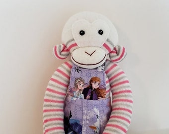 Sock monkey in overalls,  stuffed animal