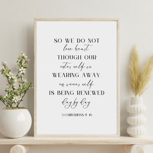 May include: A framed print with a white background and black text. The text reads: "So we do not lose heart. Though our outer self is wearing away, our inner self is being renewed day by day. 2 Corinthians 4:16"