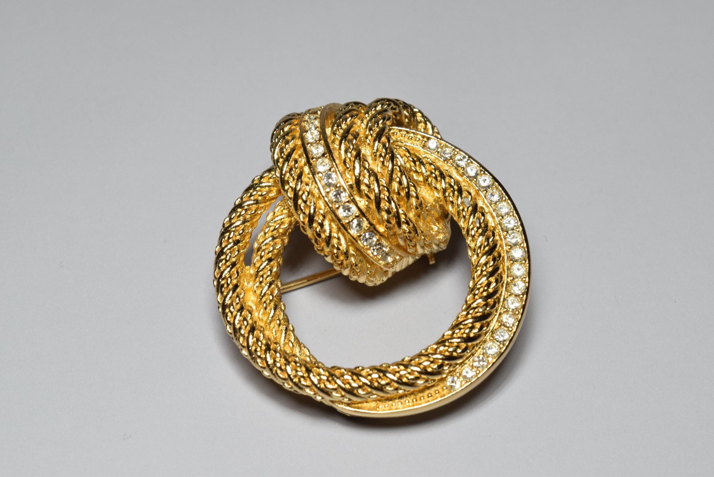 Vintage Collection Gold Tone Christian Dior 1970s Knot Clear Vintage Collection Gold Tone Christian Dior 1970s Knot Clear