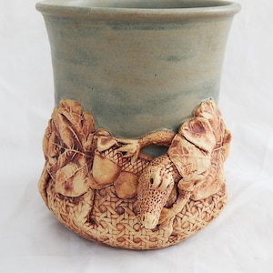 Hand made stoneware utensil holder/wine cooler oak and acorn and a gator.