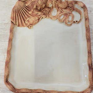 Nautical themed  charcuterie platter,  stoneware, octopus, turtle, shells, and crab. 15% discount at checkout, apply code 11642LK