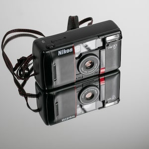 Nikon TW 20 AF point and shoot camera.