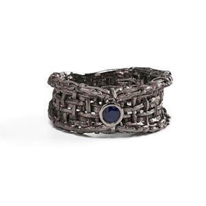 Handmade 925 silver ring with an expressive torn black rhodium-plated design, featuring a deep blue sapphire. A bold, sculptural September birthstone statement ring. Oren Blue Sapphire Ring GERMAN KABIRSKI