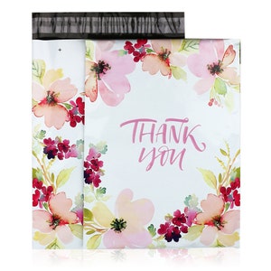 May include: Pink and white floral patterned mailing envelope with a thank you message in pink lettering.