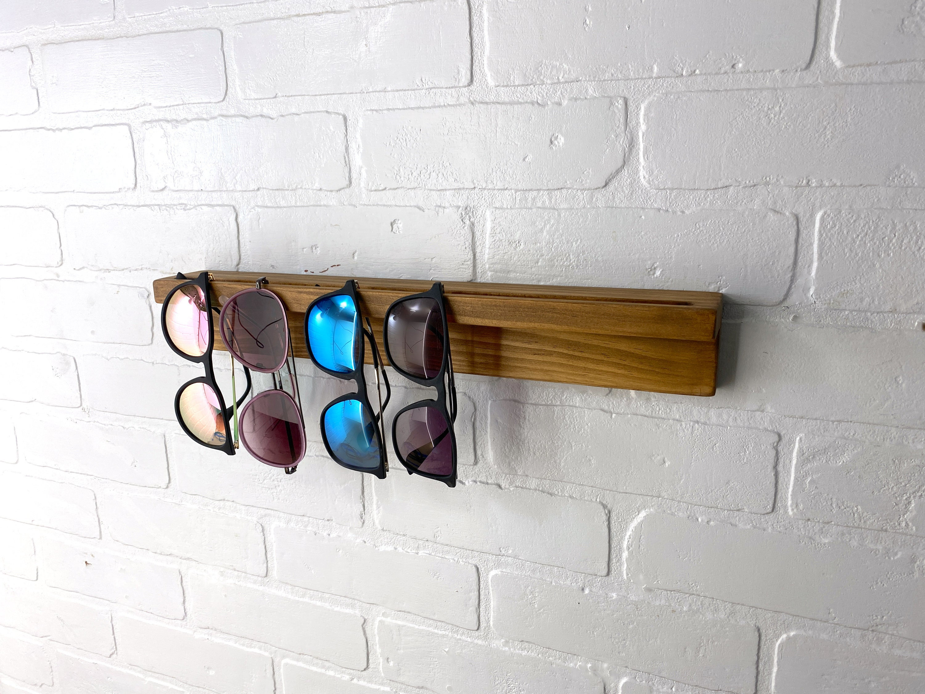 Comprar Organizador de gafas de sol para colgar en la pared, soporte para  gafas, almacenamiento, colgador de bolsillo para exhibición en la pared