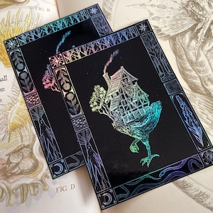 May include: A black and iridescent holographic sticker with a detailed illustration of a house perched on a bird-like creature with a long neck and legs. The house has a chimney and a pointed roof. The sticker is surrounded by a decorative border with floral and geometric designs.