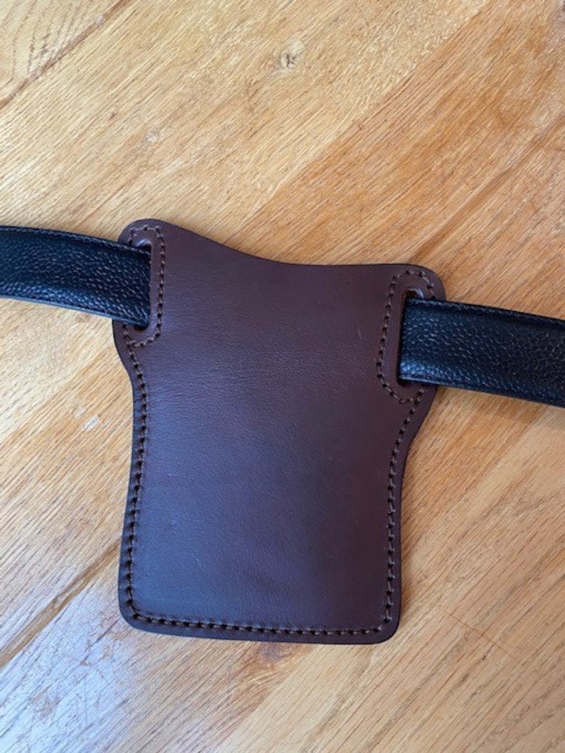 /'pancake/' style iPhone case Will take any model in veg tanned leather slides on your belt Custom made