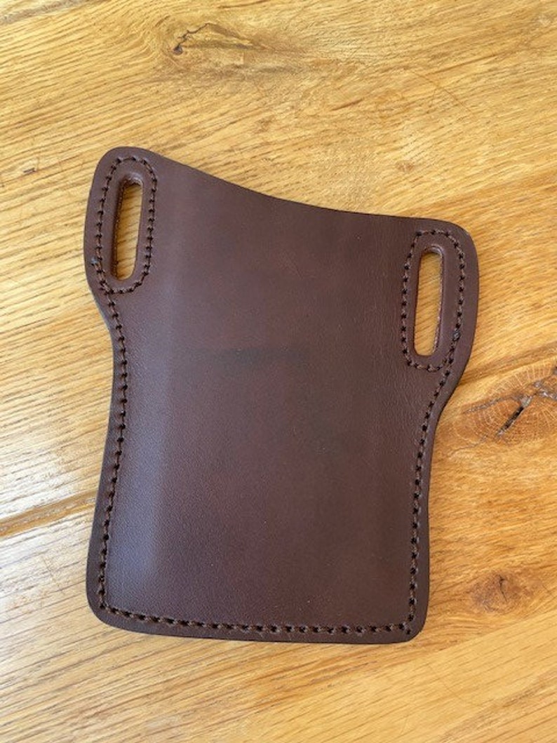 /'pancake/' style iPhone case Will take any model in veg tanned leather slides on your belt Custom made