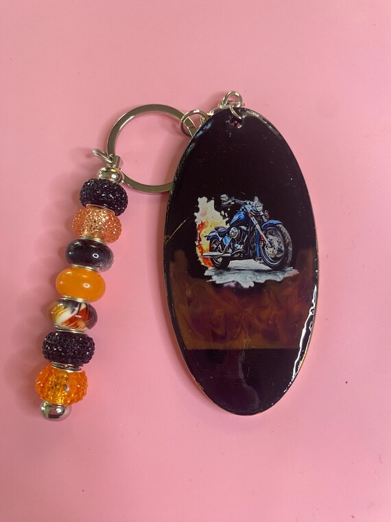 Handmade resin keychain. With Harley Davidson bike on it, this has black/orange beads.