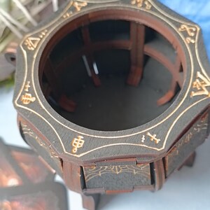 Dark gothic wooden cauldron box with mystical symbols, handcrafted fantasy storage for Wiccan jewelry, runes, potions, and herbs, rustic aged altar decor with engraved magical patterns, enchanted spell jar holder, occult-inspired trinket box, witchcraft-themed gothic home decor, handcrafted witchy altar piece, spiritual magic ritual accessory, perfect gothic Halloween decoration, wooden fantasy keepsake storage, dark academia gift for witches and tarot readers