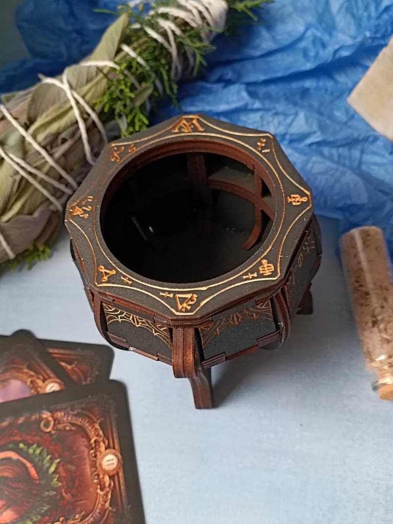 Rustic Wiccan wooden cauldron box with intricate gothic engravings, aged finish for a mystical look, handcrafted fantasy storage chest for jewelry, runes, potions, and herbs, enchanted spell jar organizer, witchy altar accessory for pagan rituals, dark academia-inspired gothic decor, handmade Halloween witchcraft keepsake, perfect occult-themed home accent, mystical wooden trinket holder, unique handcrafted magic potion storage, gothic fantasy home decor for witches and spellcasters
