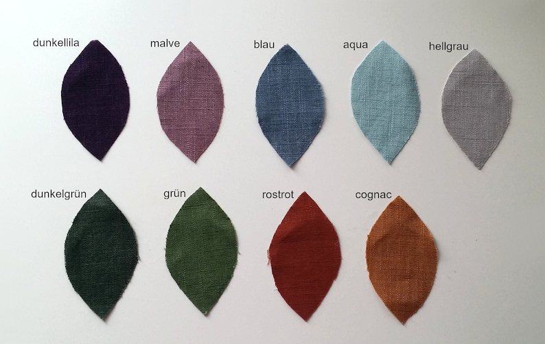 Puede incluir: Diez muestras de tela en varios colores, incluyendo morado oscuro, rosa, azul, aguamarina, gris claro, verde oscuro, verde, &oacute;xido y naranja. Las muestras est&aacute;n dispuestas en dos filas de cinco, con los nombres de los colores escritos encima de cada muestra.