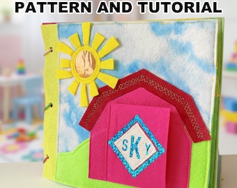 May include: A handmade felt quiet book for toddlers, featuring a farm scene with a pink barn, yellow sun, and blue sky. The book has the text "TODDLER QUIET BOOK PATTERN AND TUTORIAL" at the top.