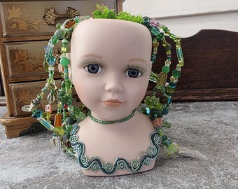 Porcelain doll head planter with hand beaded plant: waterless plant