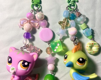 Llaveros de cuentas de nueva generación de LPS con pájaro carpintero y zarigüeya