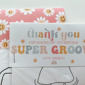 May include: A white thank you card with pink and yellow daisies and the text "thank you for making my 4th birthday super groovy love, Madilyn".