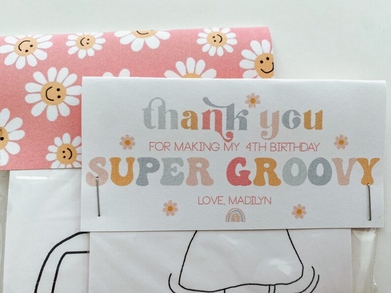 May include: A white thank you card with pink and yellow daisies and the text "thank you for making my 4th birthday super groovy love, Madilyn".