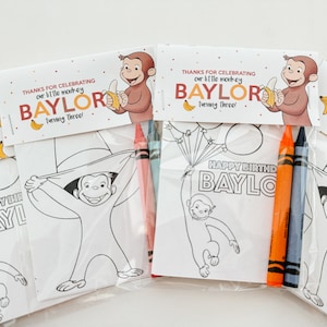 May include: A set of four party favor bags with coloring pages featuring Curious George. Each bag includes a coloring page, two crayons, and a tag that says "Thanks for celebrating our little monkey Baylor turning three!"