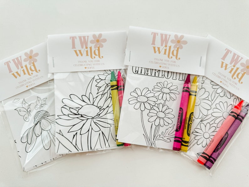May include: Four party favor bags with coloring pages and crayons. Each bag has a tag that says "TW Wild." The tags also include the names "Sofia" and "Charlotte".