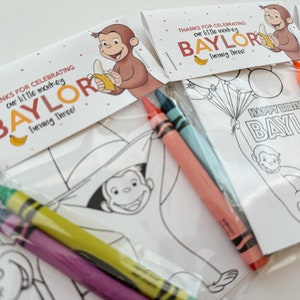 May include: A set of three party favor bags with coloring pages featuring Curious George. Each bag includes three crayons and a tag that says "Thanks for celebrating our little monkey Baylor turning three!"