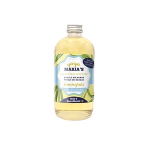 May include: A clear glass bottle of lemongrass dish soap with a silver lid. The label is blue and yellow with the text "yaya MARIA'S ALL-NATURAL DISH SOAP GENTLE ON HANDS TOUGH ON GREASE lemongrass 16 FL OZ (473 ML) Only 6 Ingredients!"