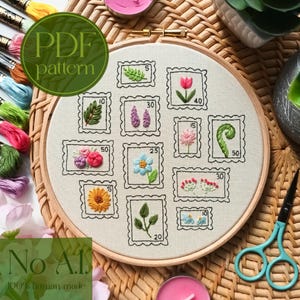 May include: An embroidery hoop featuring a floral stamp design. The design includes various embroidered flowers and leaves within postage stamp frames. The text "PDF pattern" and "No AI. 100% human made" are also visible.