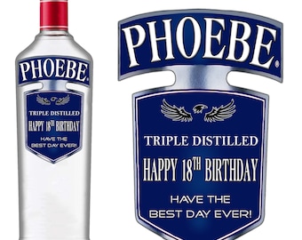 May include: A blue and silver personalized bottle label with the name "PHOEBE" and the text "Triple Distilled Happy 18th Birthday Have the Best Day Ever!"