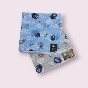May include: Two blue and gray cotton handkerchiefs with a repeating pattern of blue and black mythical creatures on a white cloud background. The handkerchiefs have a small black label with the Japanese word "和" printed on them.
