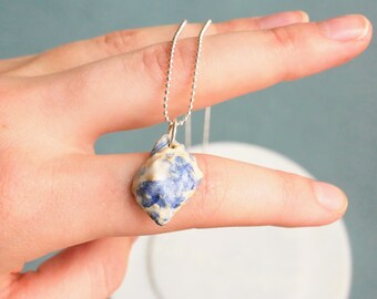 Ceramic necklace seashell with silver-plated necklace.