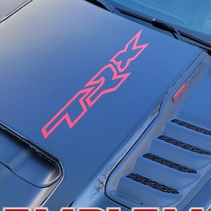 May include: Black vehicle bonnet featuring a red "TRX" emblem decal. The image also displays the Mopar logo and the text "OFFICIAL LICENSED PRODUCT" and "EMBLEM DECALS".