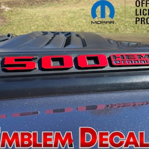 May include: Red and black 1500 Hemi 8 Torque emblem decals for a truck. The decals are made of high-quality vinyl and are designed to last. They are easy to apply and remove, and they will not damage your paint. Official Licensed Product.