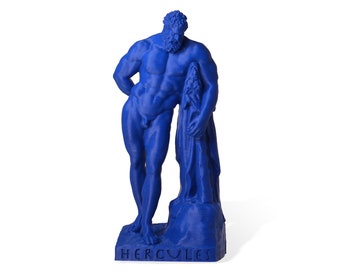 May include: A blue plastic statue of Hercules, a Greek mythological figure, standing with a club in his right hand. The statue is on a base with the word "HERCULES" inscribed on it.