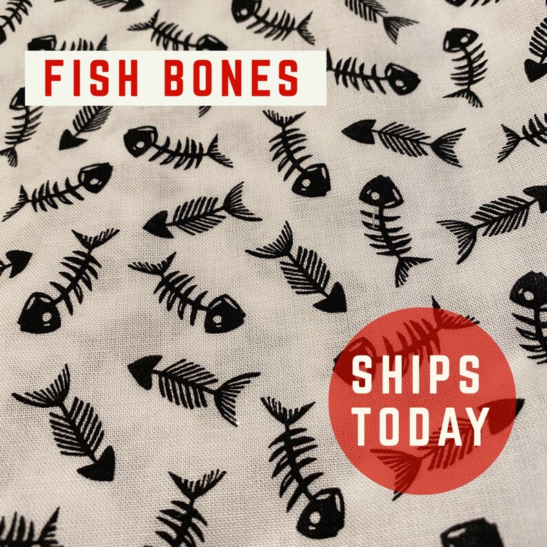 May include: White fabric with a black repeating pattern of fish bones. The text "FISH BONES" is in red at the top of the image. The text "SHIPS TODAY" is in white on a red circle at the bottom of the image.