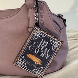 May include: A set of three ceramic mugs with a speckled, matte finish in cream, light grey, and dark grey. Each mug has a simple, minimalist design, ideal for tea or coffee.