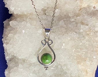 Gaspeite pendant set with sterling silver, rare and natural green stone