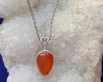 Carnelian pendant set with sterling silver, simple setting