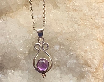 Round amethyst pendant set with sterling silver