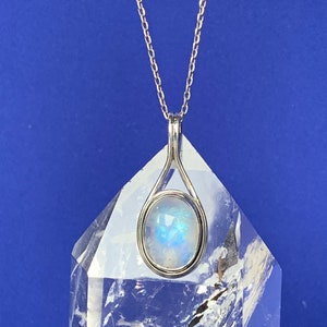Moonstone pendant set with sterling silver, blue reflection gemstone, modern design