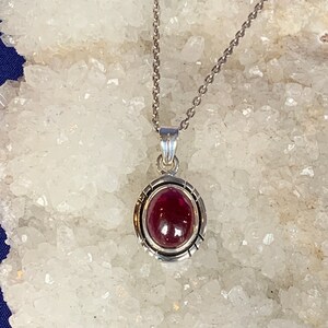 Red garnet pendant set with sterling silver, finely worked silver, for a man or a woman