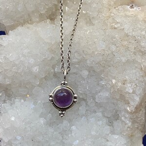 Amethyst pendant set with sterling silver, small, natural ,round, violet gemstone