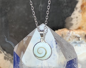Shiva eye or Saint Lucia eye pendant set with sterling silver, round shape, white with spiral sea shell