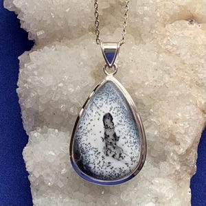 Large dendrite opal pendant set with sterling silver, natural white and black stone
