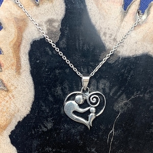 Sterling silver heart pendant, representing a mother with a child