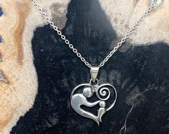 Sterling silver heart pendant, representing a mother with a child