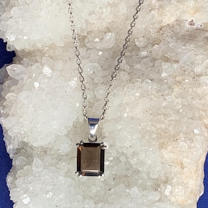 Faceted smokey quartz and sterling silver pendant, simple setting, rectangular shape