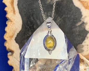 Amber pendant set with sterling silver, finely worked, oval shape